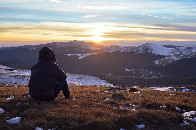 Man alone on mountain top