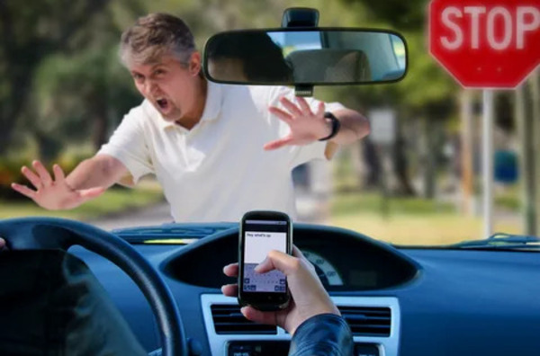 pedestrian almost hit by driver texting